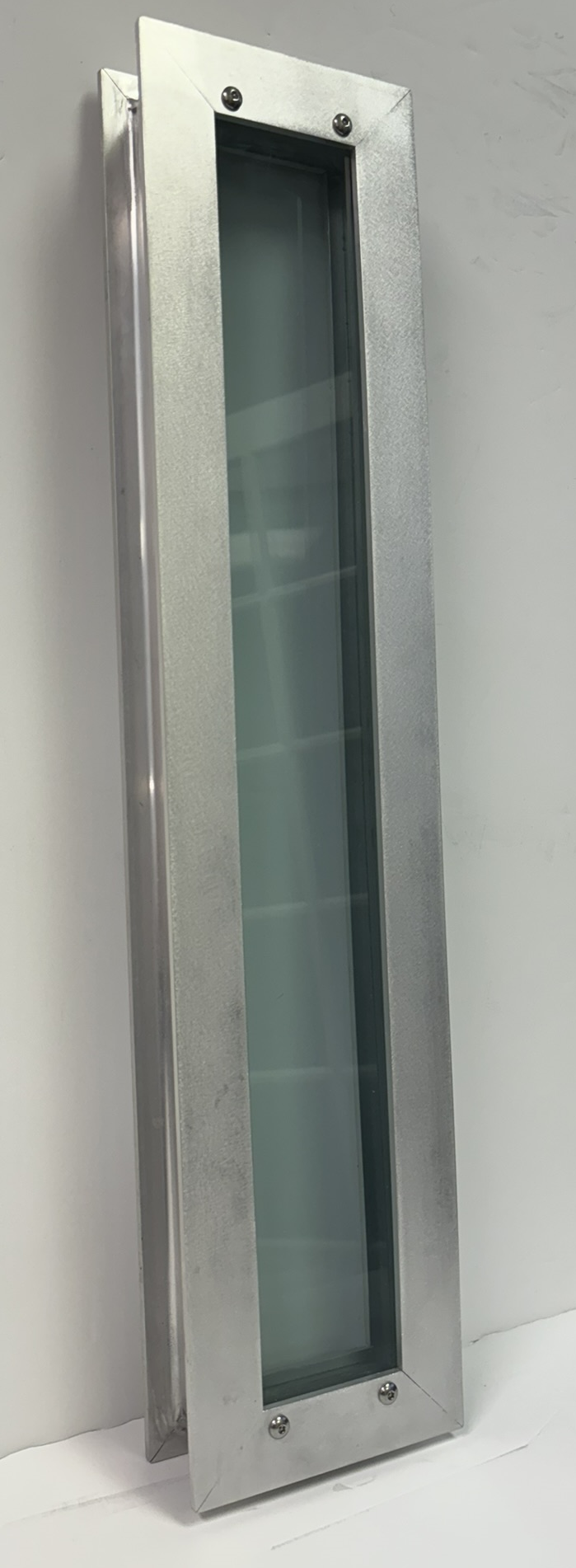The RetroKIT panel — an aluminum-framed UL 752 glazing unit cut to a classroom door vision lite.